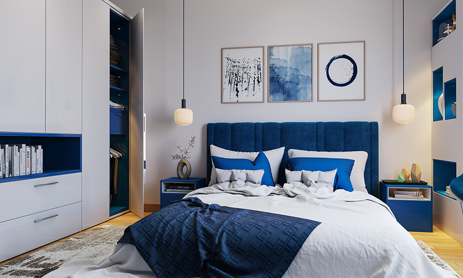 2 door wardrobe with bookshelf and a drawer that white and blue laminate is the colour scheme of this bedroom.