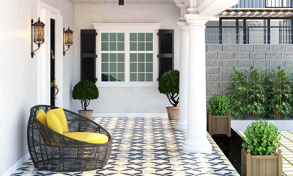 Artistic house porch design with mosaic floor tiles will personalise your home's entrance, and plants add greenery.