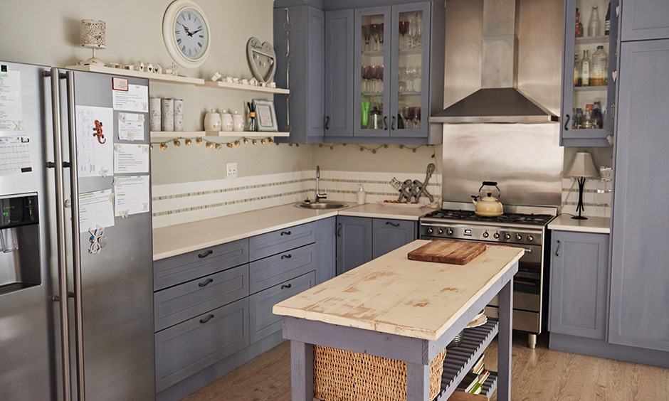 Country style kitchen design with cabinets that have been finished with Duco