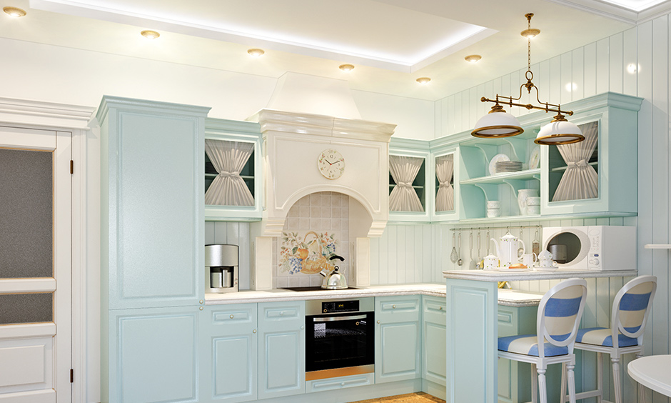 Different types of false ceiling lights in a pretty pastel blue kitchen with led and cove lights