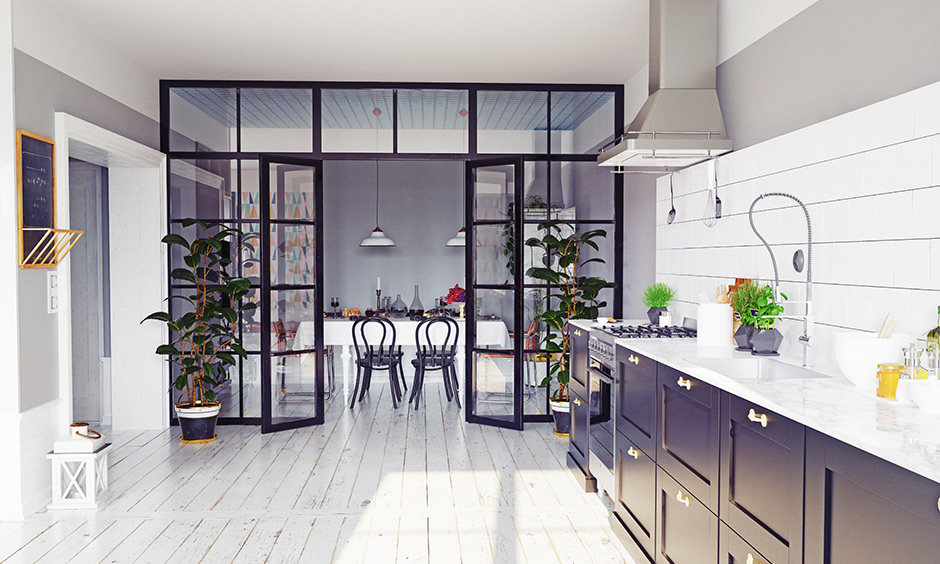 This black-framed glass panel partition between the kitchen and dining room is sophisticated and also let in more light.