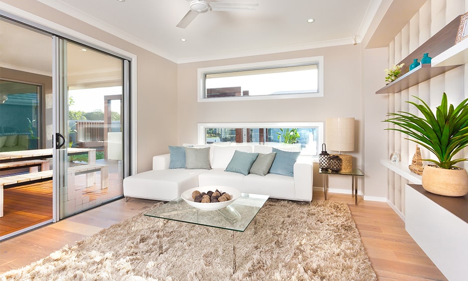 A glass top coffee table with a bowl of acorns makes a nice glass coffee table in living room