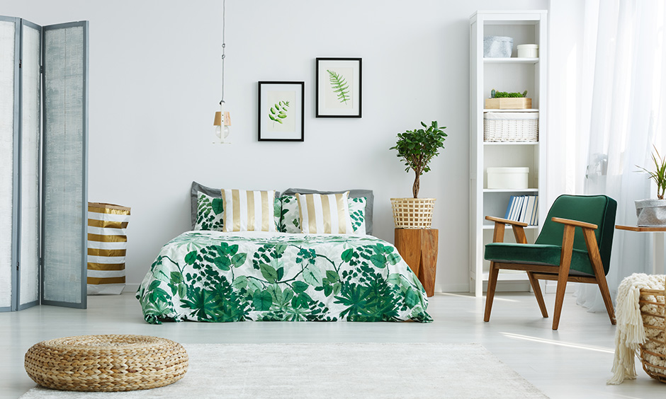 Green bedroom furniture with gold and white stripes cleverly used to balance out all the green.