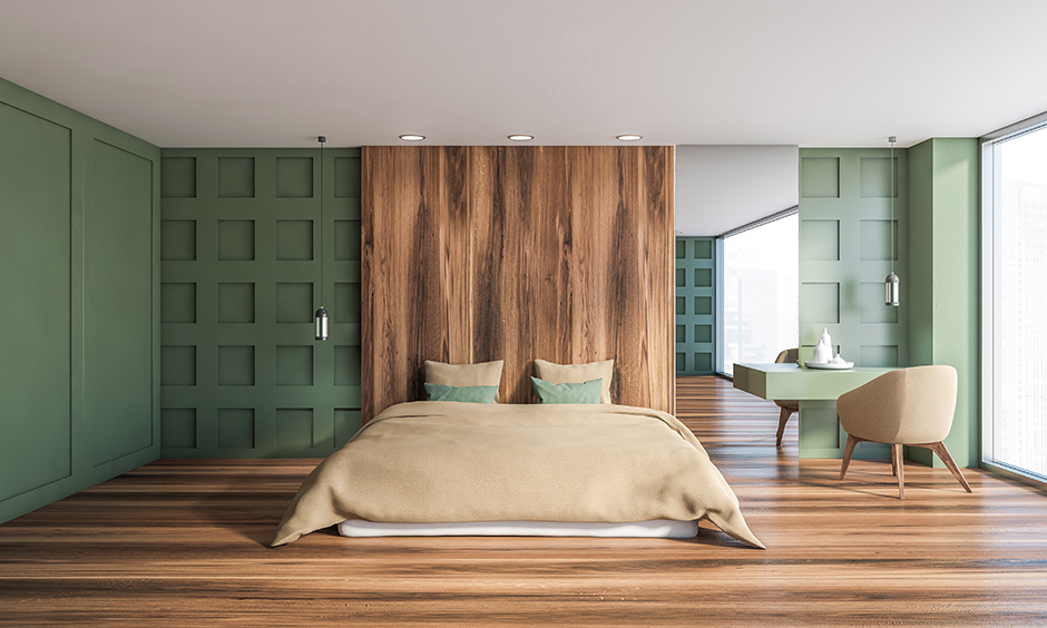 Beige chairs and bed blends well with green colour bedroom and looks classic.