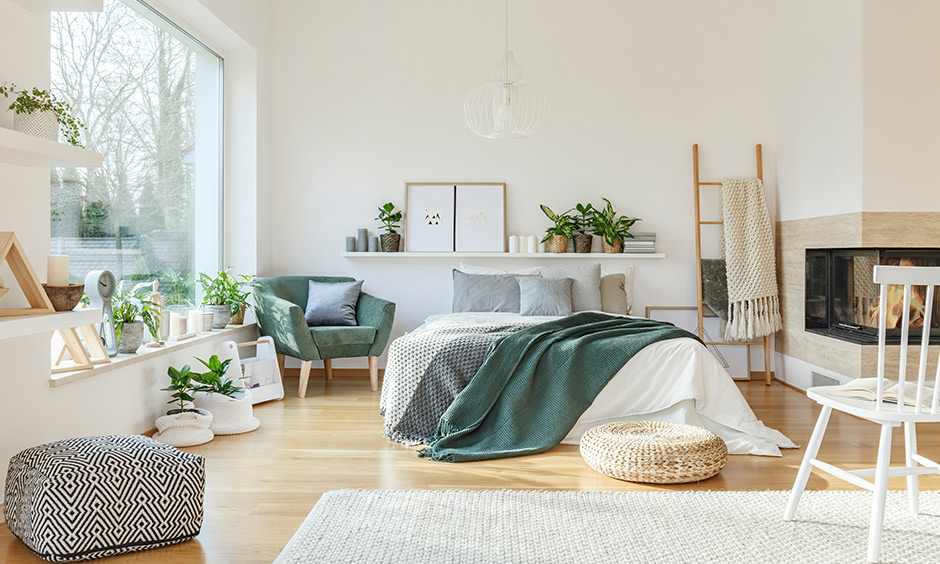 Green bedroom with plants to give life and add visual interest and also help purify the air regularly.