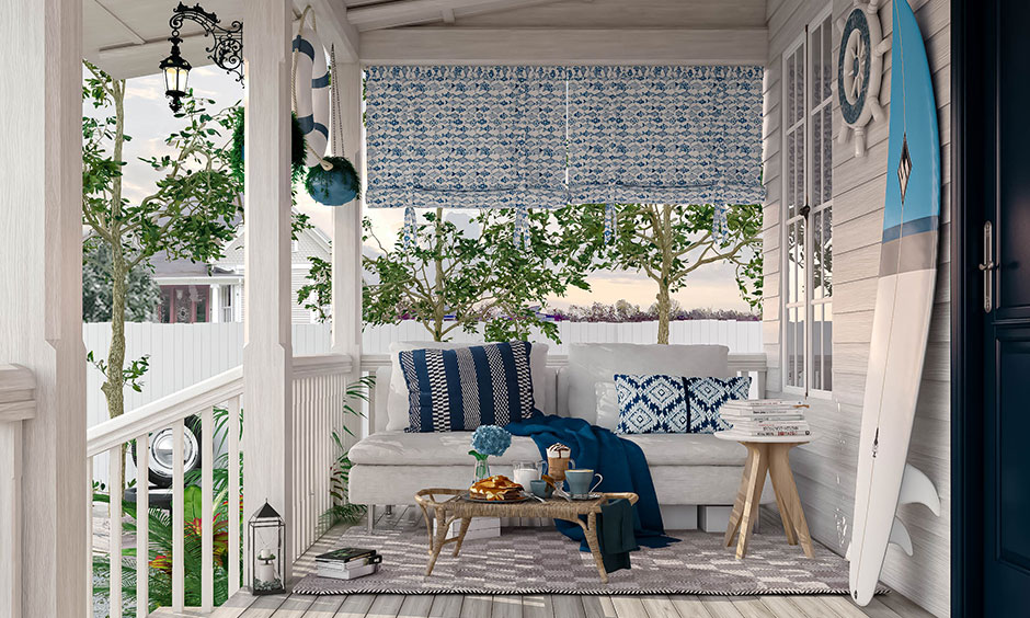 Front porch in white and blue nautical theme lends a beachy vibe