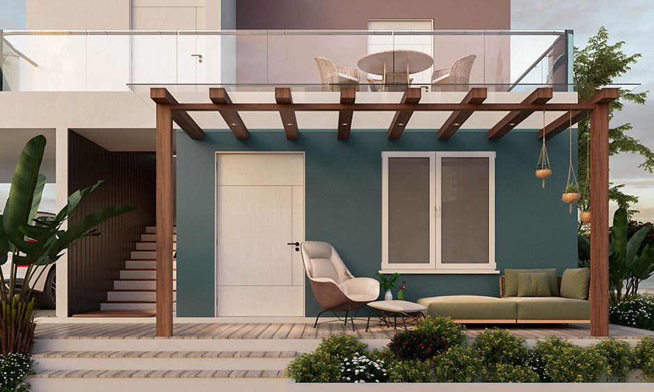 Modern, chic and minimalist house porch design with a pergola, a comfortable couch, and an armchair looks elegant.