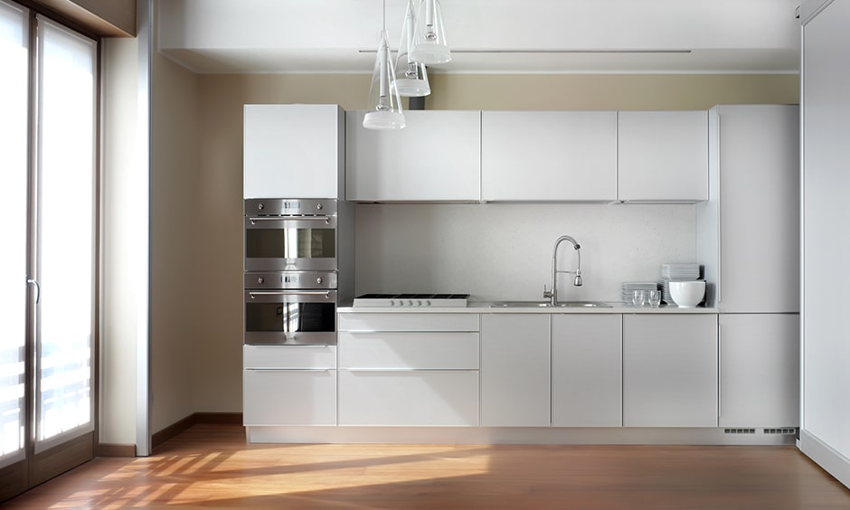 Modern high gloss white kitchen cabinets brings shiny, sleek and stunning to look