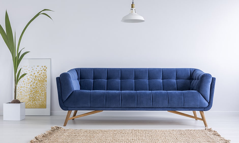 Mid-century modern style sofa design with a rectangular shape, a tufted back seat and wooden legs