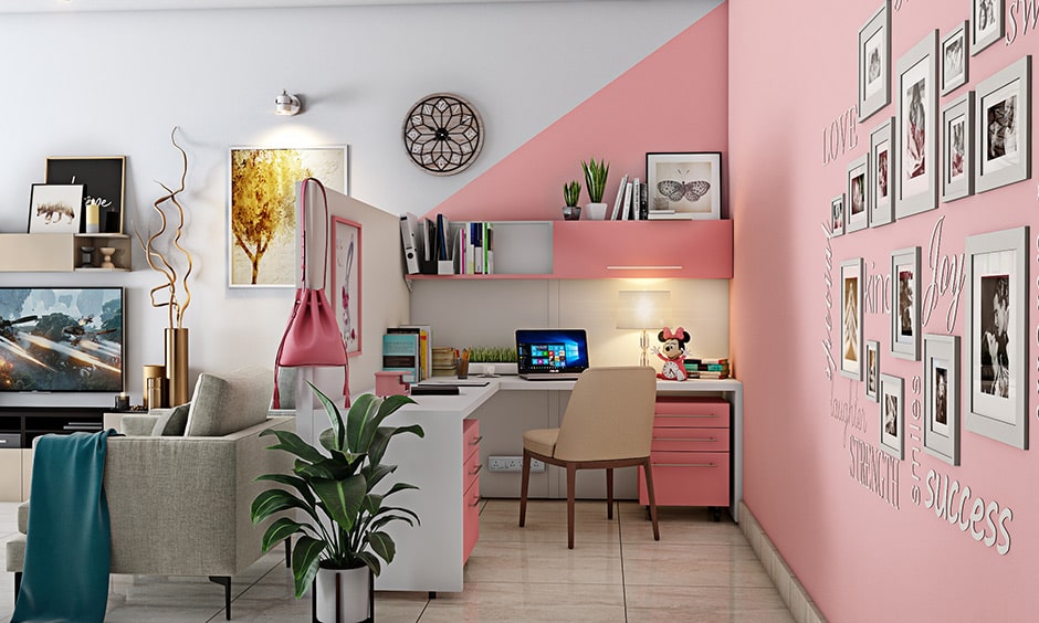 Cubicle decor ideas with photo frames on the wall and white and pink study table