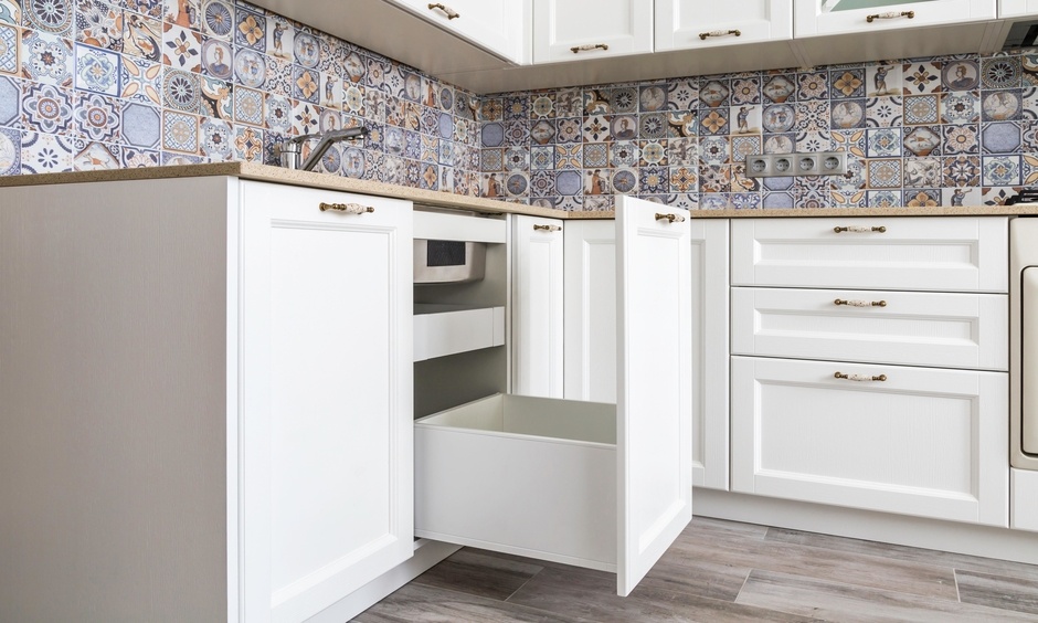 Under kitchen sink pull out storage helps to store items from kitchen microfiber towels to empty pots and pans.