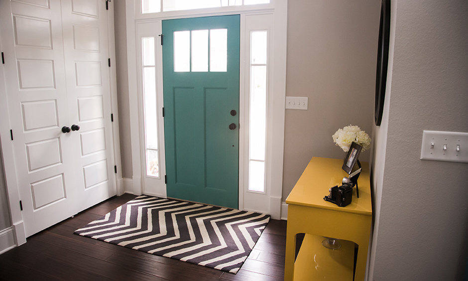 An entryway wall side table has a multitude of purposes can place keys, mail organisers, flower vase and pretty candles.