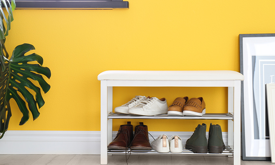 White modern shoe rack design with seat is a comfortable seating option to tie your shoelaces and head out quickly.