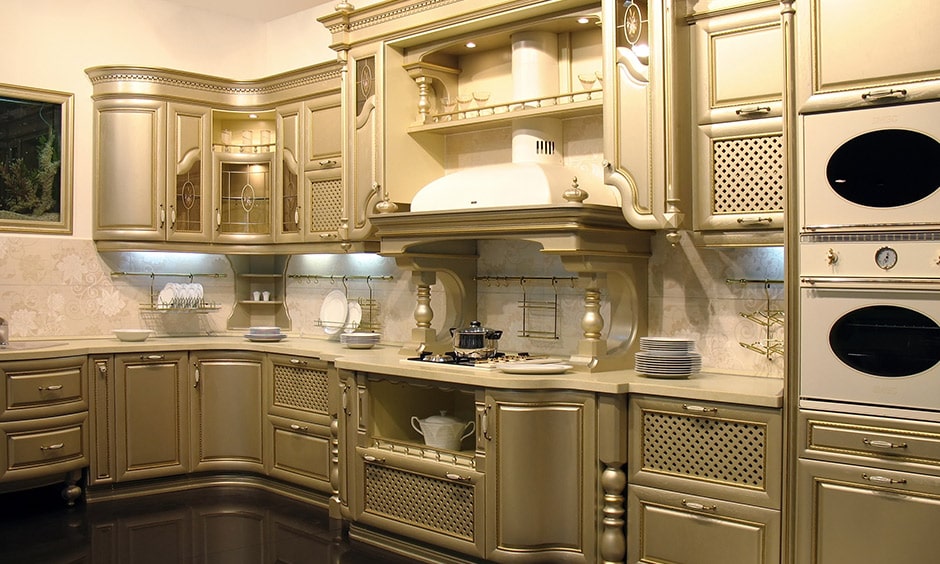 Antique kitchen design with a royal interior and beautiful light gold paint