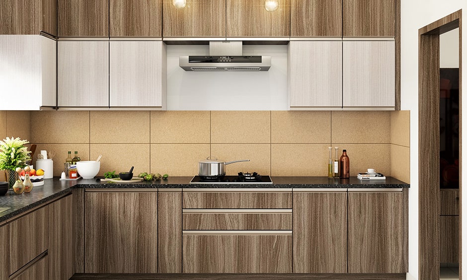 Antique oak kitchen design with the beige-color tiled backsplash and the black granite countertop