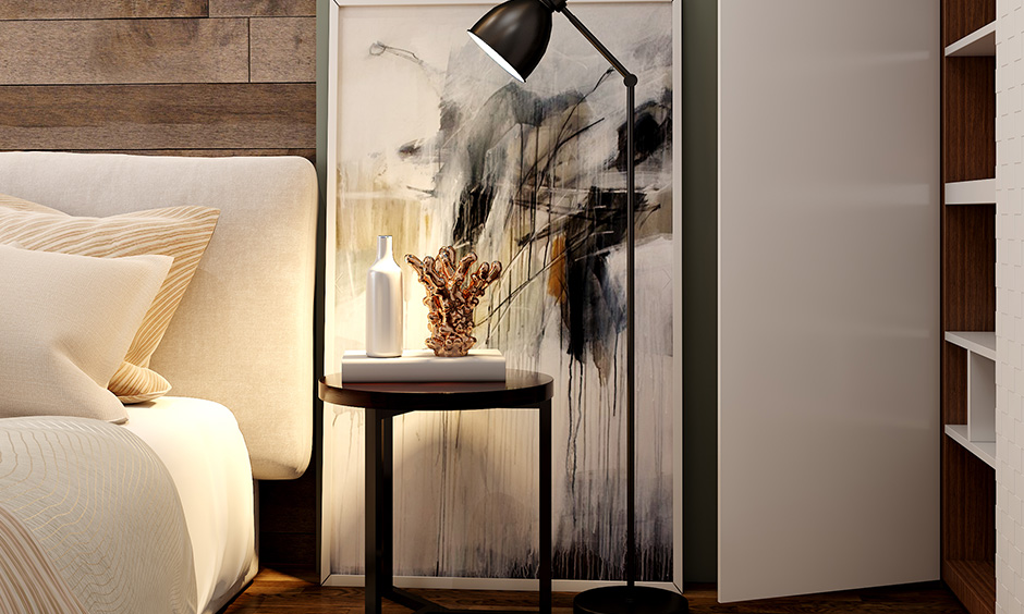 Bedside table online india for a visual appeal where the artwork and sleek lamp work in tandem