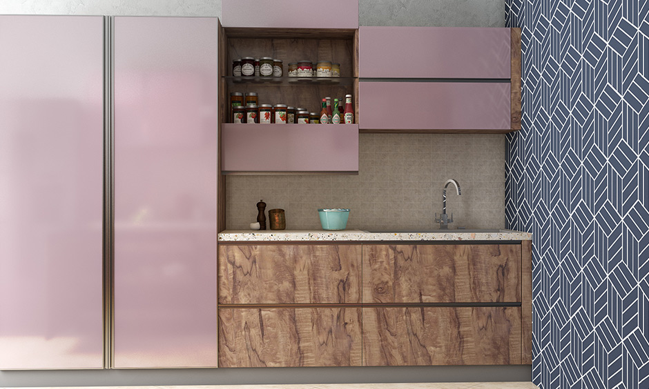 Blue kitchen colours wall with pink kitchen cabinets to be trustworthy, loyal and friendly.