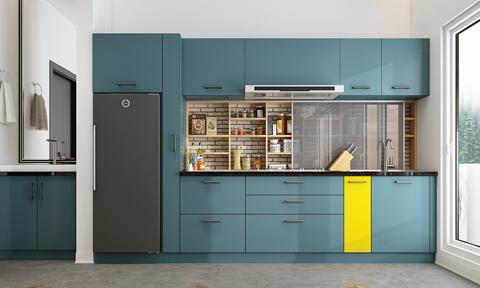 Teal blue kitchen units with a punch of yellow create an impactful impression and a very vibrant space!