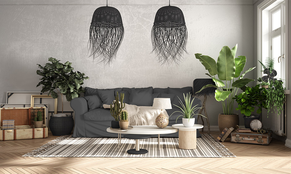 Boho grey rustic living room with plants, rugged textiles, and chic furniture which is great for spacious homes 