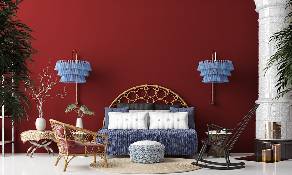 Breakrules with bohemian home decor ideas with a deep red wall and lampshade with powder blue tassels