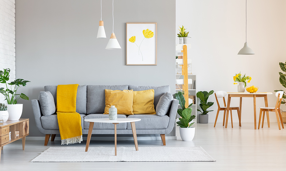 Yellow living room accessories look incredibly mesmerizing, yellow cushions and vases to add some sunshine in living room