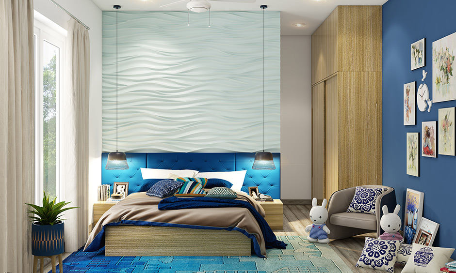 Custom plush bedroom rugs in shades of blue with the headboard at the top