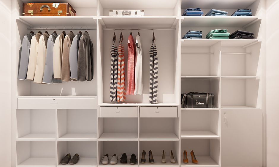 Dressing room cupboard which is all white and shelves and drawers are basic