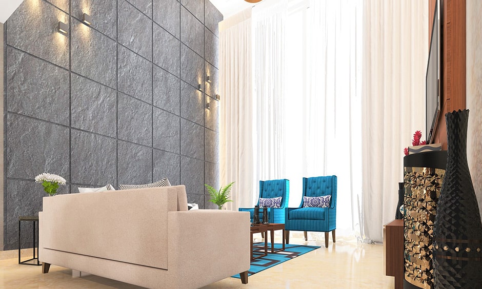 Grey colour of the wall gives a class and elegance look to your living room