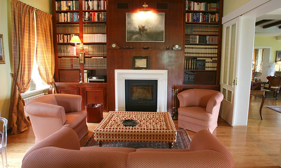 Home library ideas with a sweet cosy home library with a fireplace