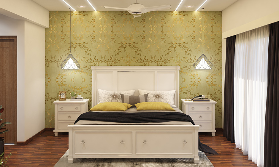 Master bedroom with a chest of drawers, bedside tables and beautiful olive green wallpaper interiors in ramagodanahalli