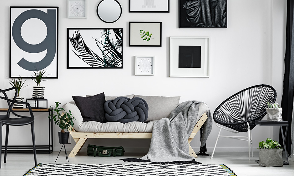 Black and white living room accessories like rugs, solid paint print art, and typo frames make a great impression.