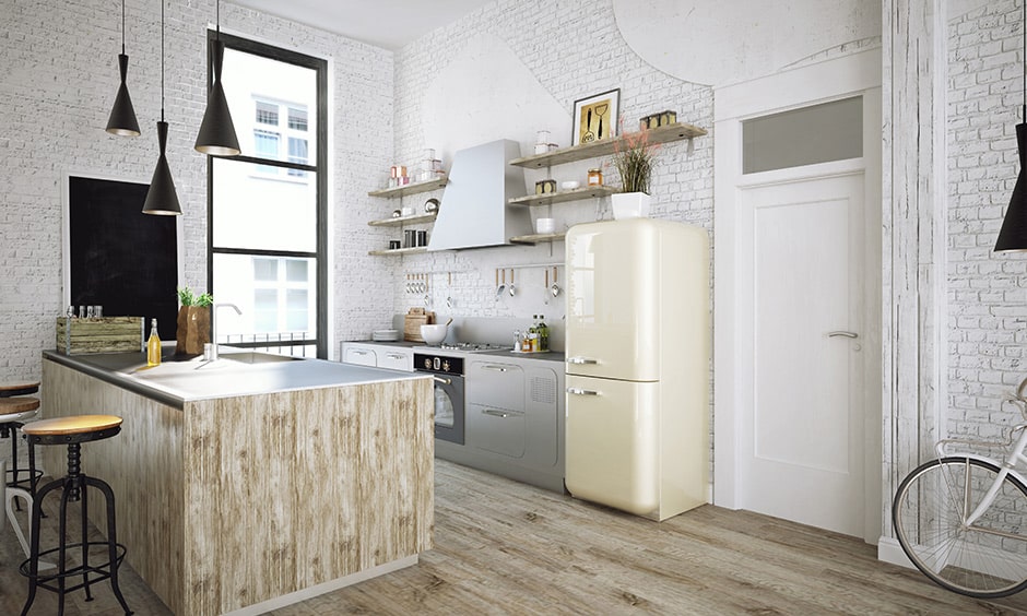 Retro kitchen with a 90's look with a brick wall and single steel oven