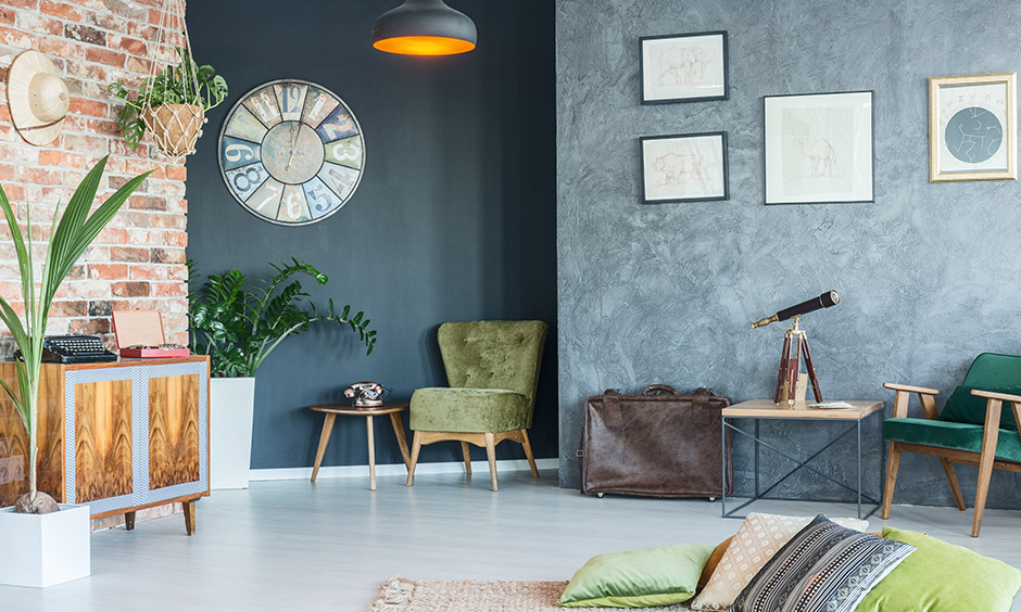 Rustic living room accessories like old reclaimed clocks, hanging fabric planters, and class chairs bring warmth to the area