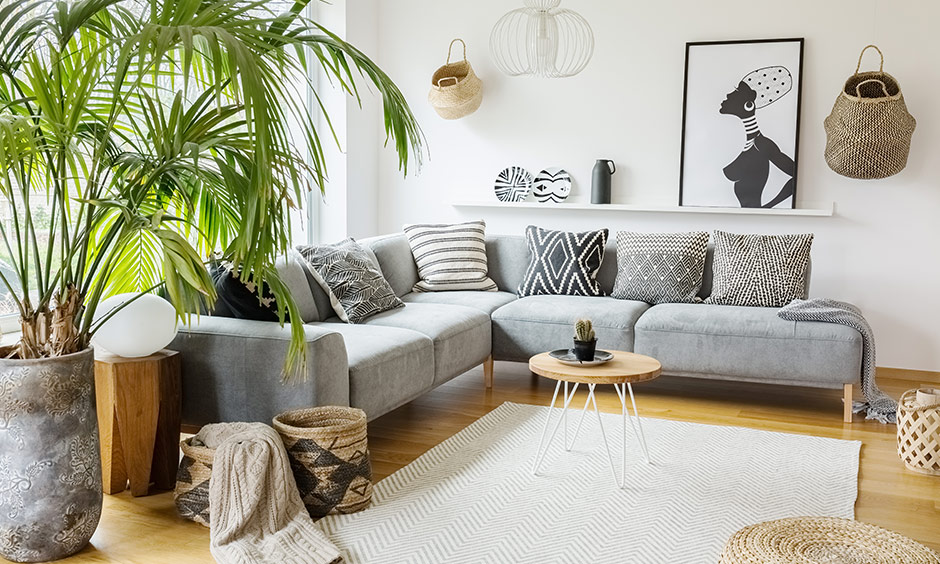 Small rustic living room design with smart placement of a sofa and a textured coffee table and knick-knacks