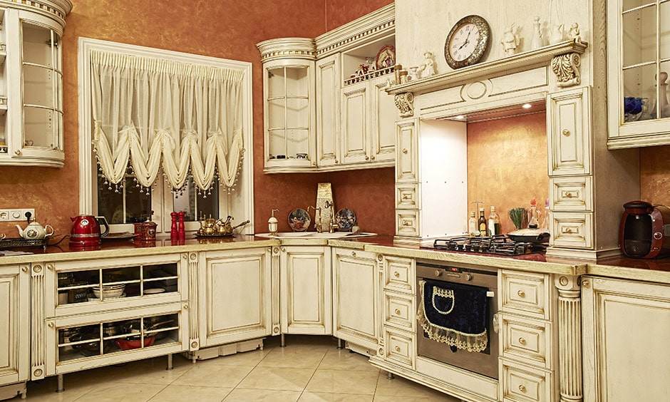 True vintage kitchen design with white interior and lace curtains