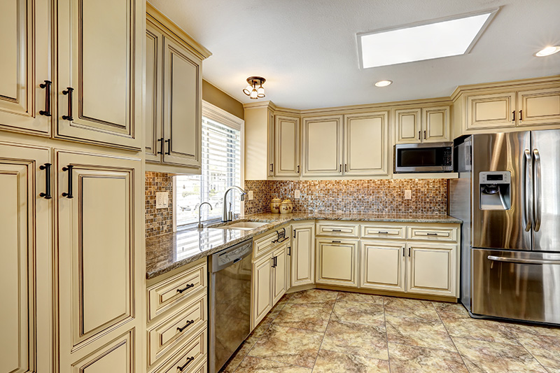 Modern kitchen cabinets in vintage style with a cool backsplash are classy