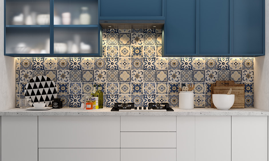 Go for solid blue kitchen units and add fun to the area with blue kitchen walls and floor in different tile designs.