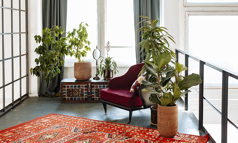 What is bohemian style with a bright patterned rug like this one instantly lifts a room