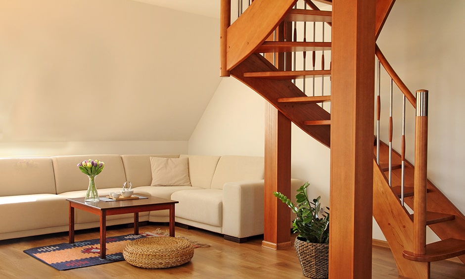 Wooden staircase with wooden flooring and cosy interiors brings minimal and stylish look