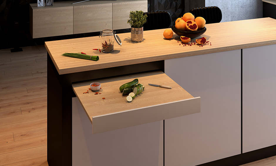 Affordable kitchen island counter design with a chopping board pull-out is a smart way to keep your worktop clean.