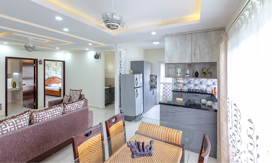 Dining area by apartments interior designers in bangalore  with dining area is also close to the kitchen by residential interior designers in bangalore 