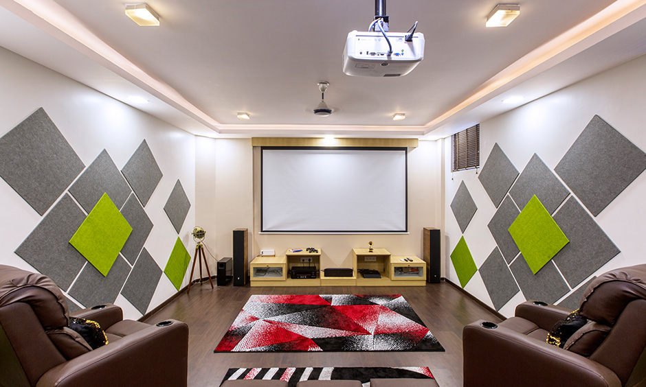 Home theatre interior decorators in Bangalore Sarjapur Road by dc designed with panels & storage brings multiplex like experience. 