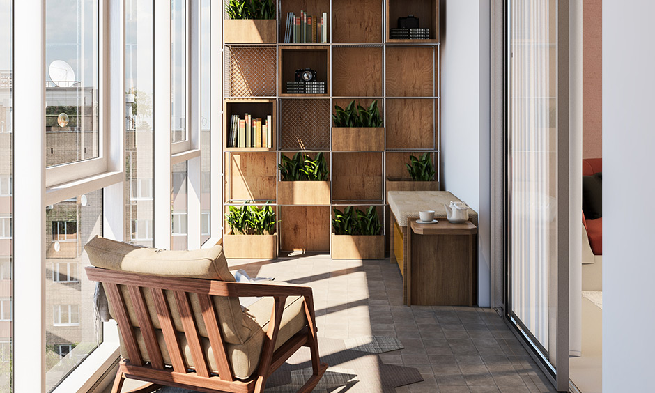 Balcony has indoor plants on wall-mounted wooden shelves with storage