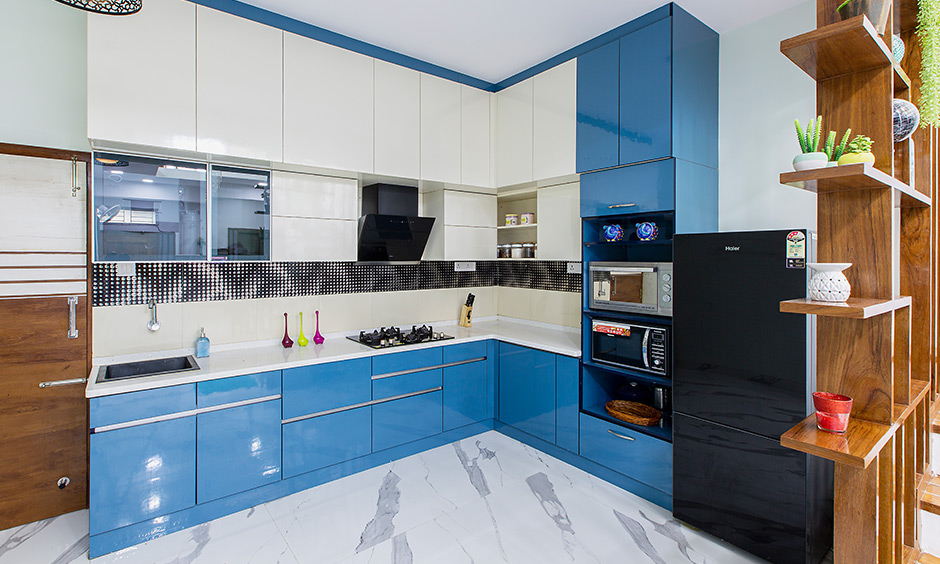 Independent house design with a bold kitchen with a bold blue and a frosty white combination