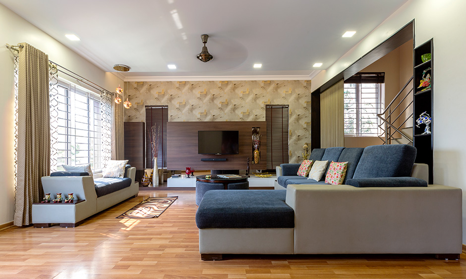 DC interior designers in sarjapur designed this living room with tv unit feel warm, cosy and comforting to all