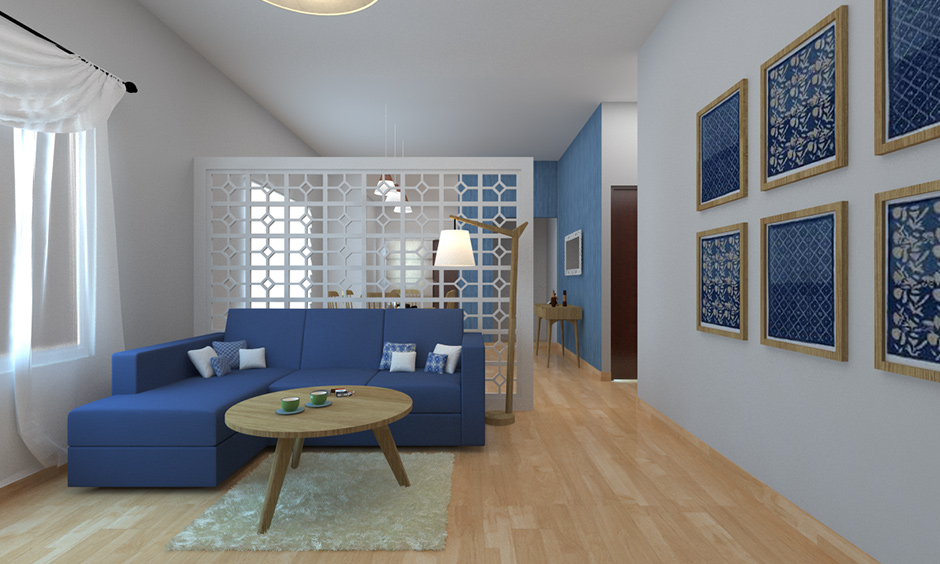 Living room decor partition with blue sofa and coffee table against the partition feel soothing to the mind, & body.