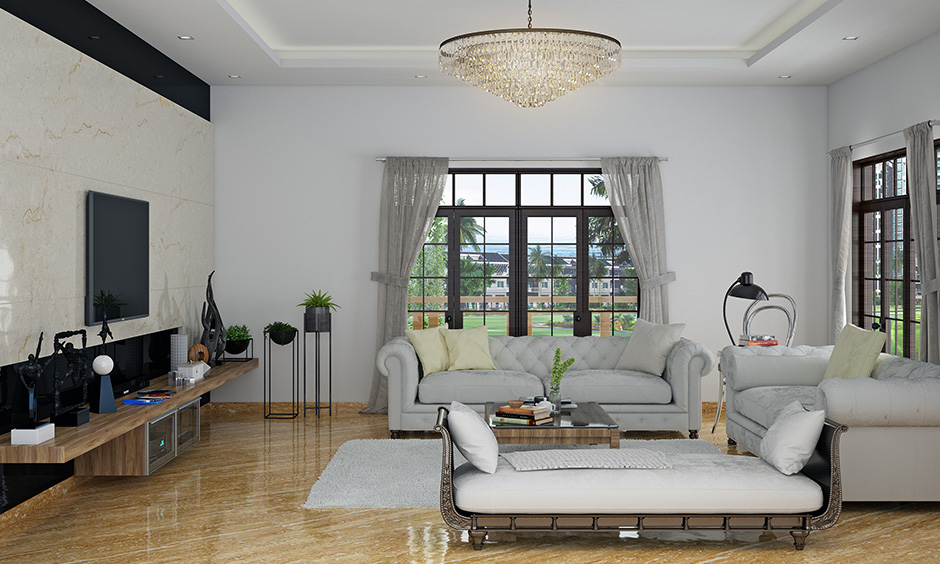 White living room seating idea classic white camelback sofa & cream coloured pillow gives a classic look.