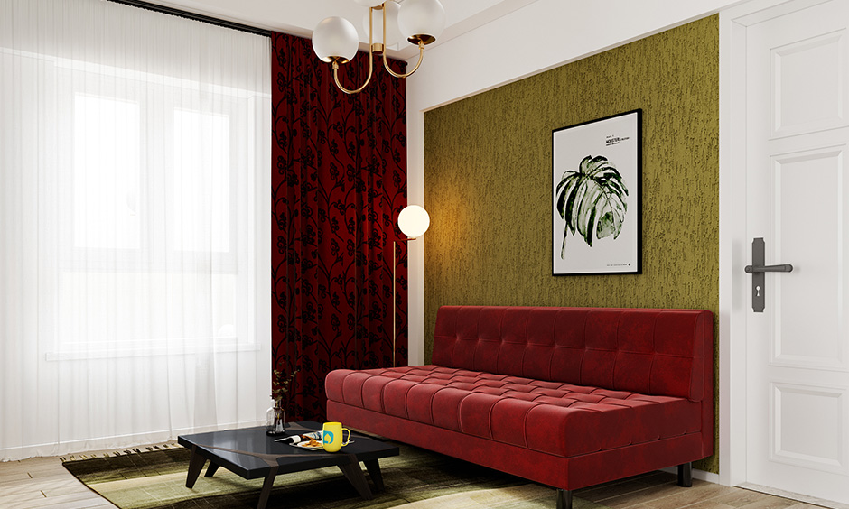 Red coloured futon sitting sofa for living room against a textured wall brings in a touch of Japanese tradition.