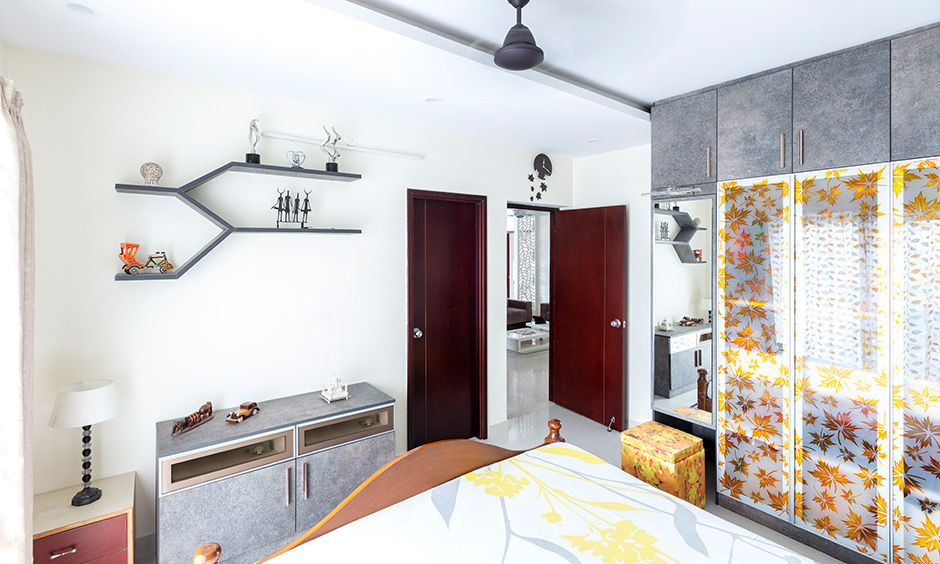 Apartments interior designers in bangalore cabinets and shelves have a grey stone finish by interior design in basava nagar