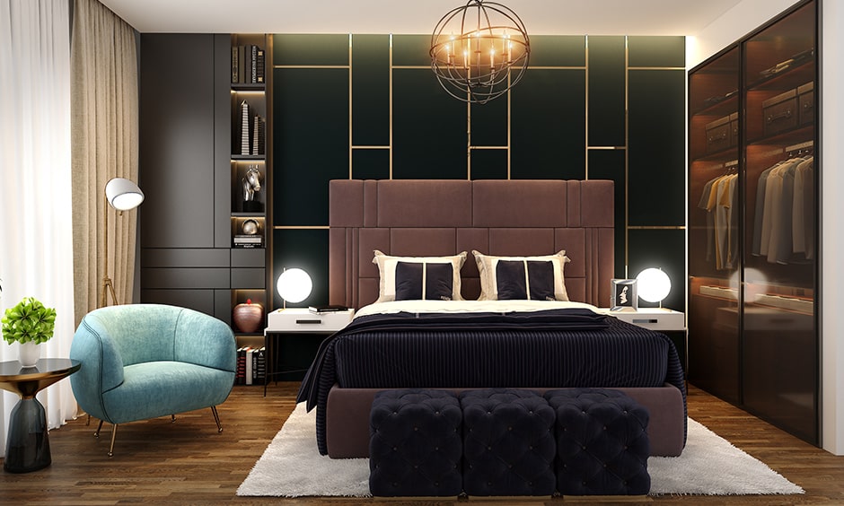 Stylish bedroom designs for couples with a blue armchair and set of dark pouffes